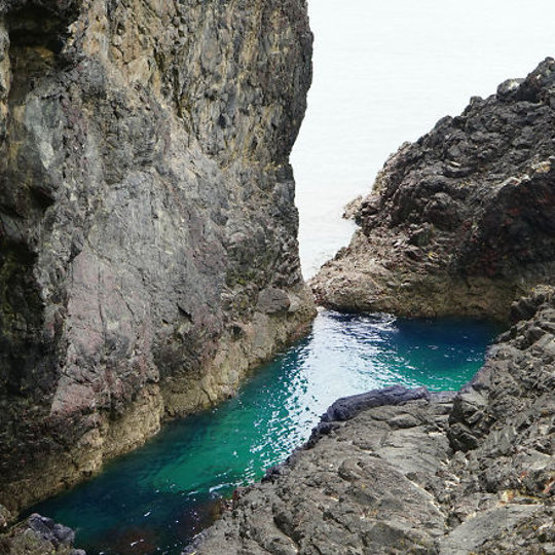 Deep sea inlet between cliffs