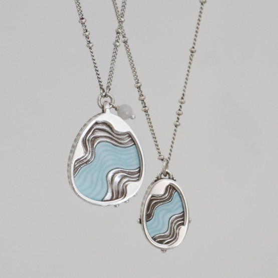 Drift Necklace and Torrent Necklace featuring wavy inlays