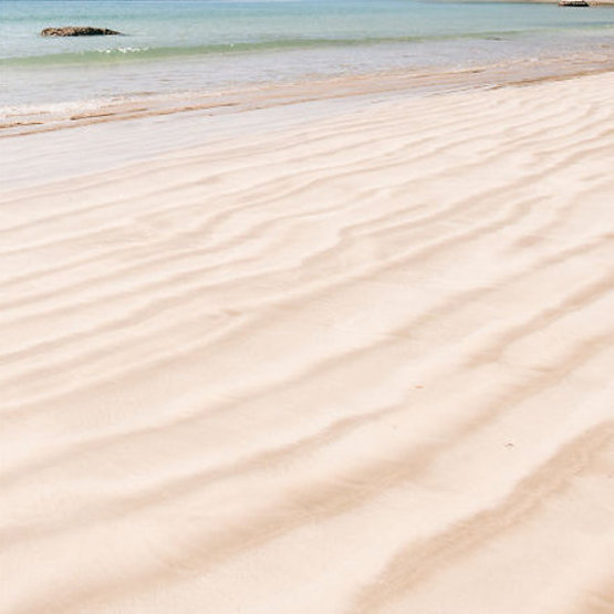 Gentle waves lapping on sand