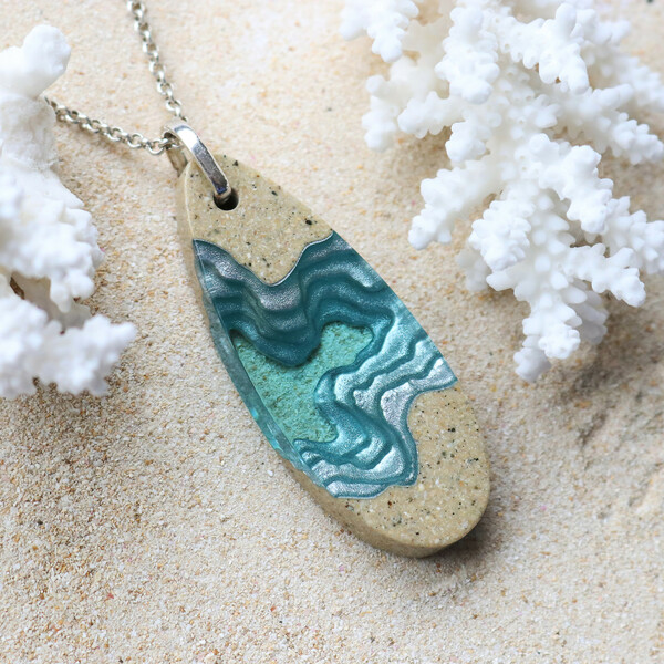 Long light blue resin pendant necklace with sea shell